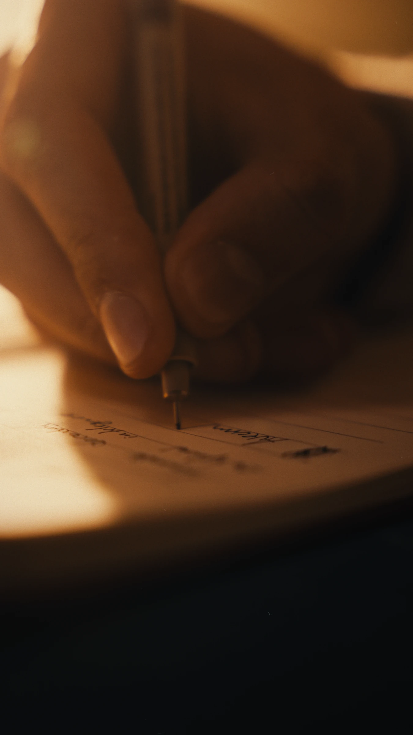 A pen writing on paper, close