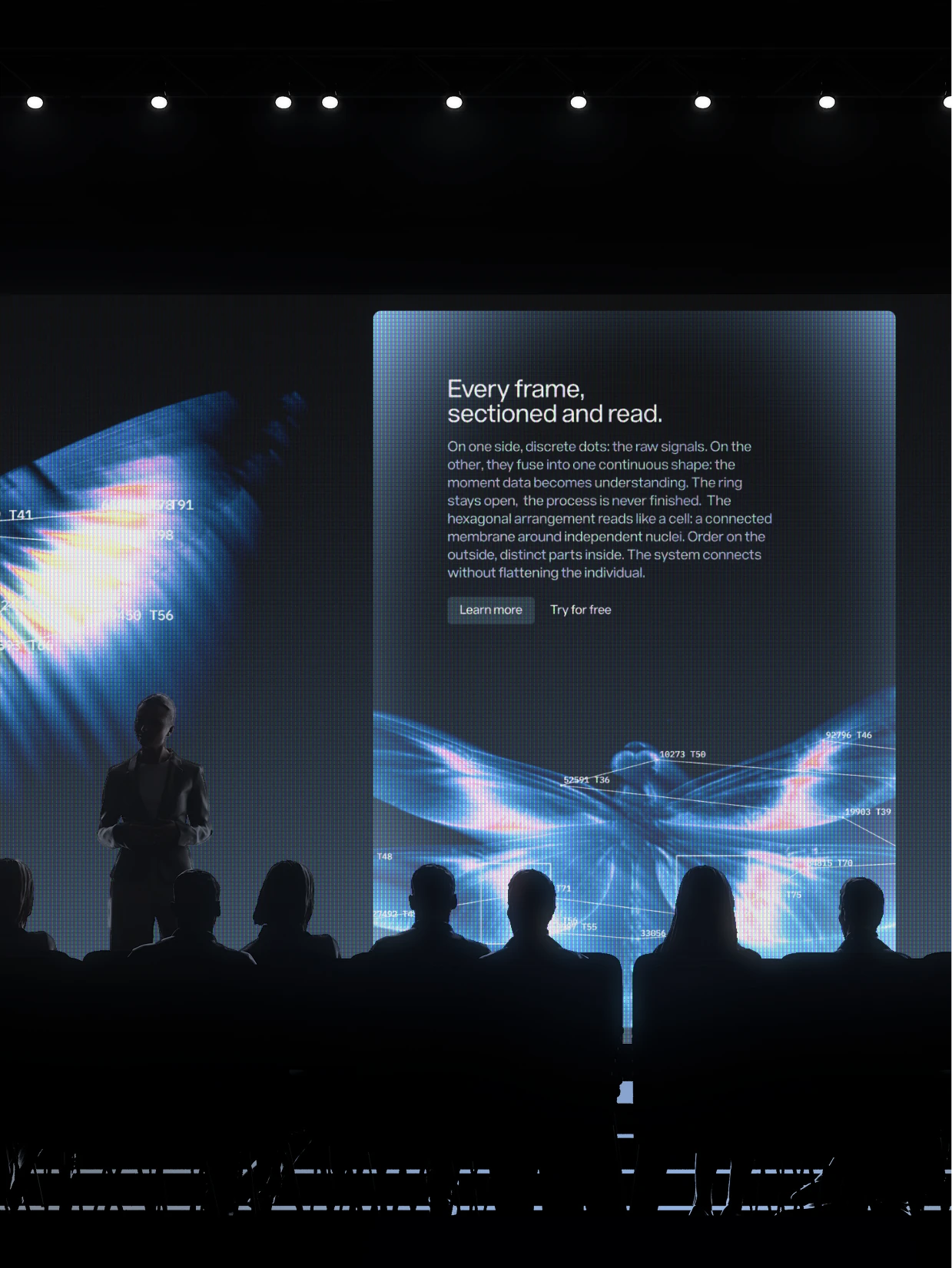 Speaker on stage before a Sixfold screen reading Every frame, sectioned and read